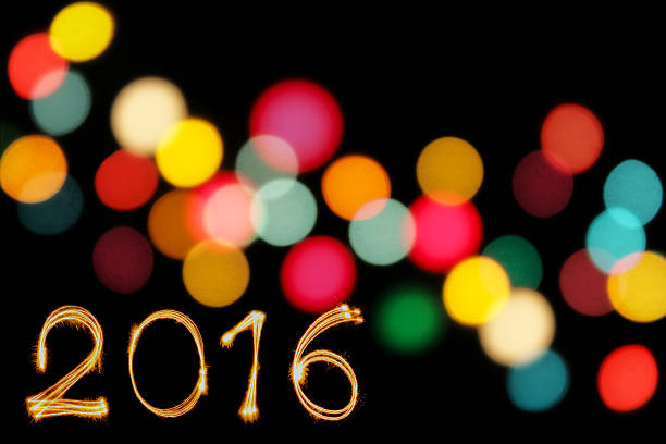 istock Happy new year 2016 writing sparkles firework with dirty defocus 493932658