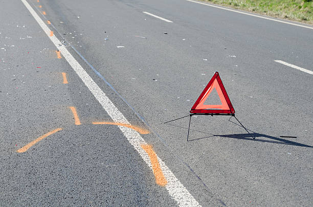 istock Warning triangle on the road after the car crash 493933004