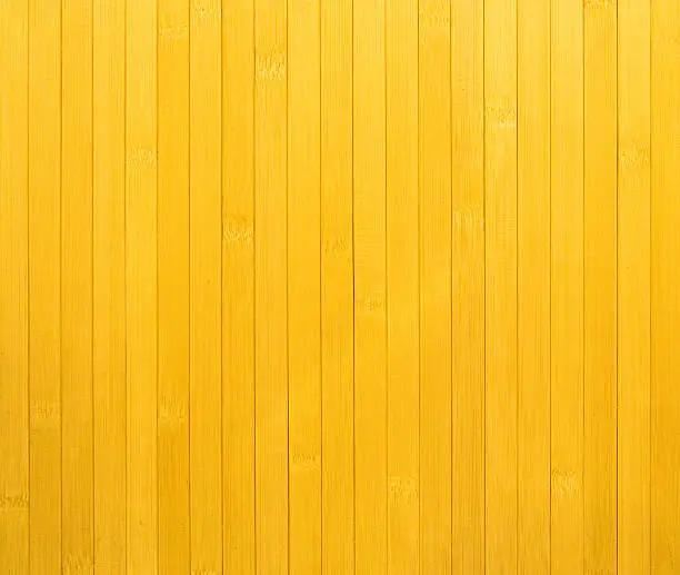 Photo of Fragment of surface (wall) of yellow wooden slats arranged vertically