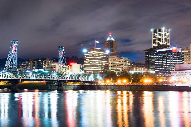 istock Portland Oregon Waterfront Willamette River Flowing Under Hawthorne Bridge 493934364