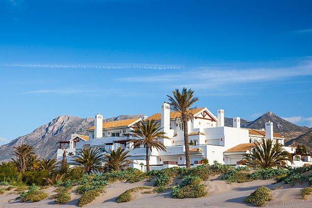 Houses along a hillside outside Marbella on the sunny coast, Costa del Sol, in Spain.