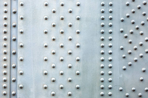 Steel plate background, closeup bridge steel beam with bolts Steel plate background, closeup Harbour Bridge large steel beam with bolts, abstract background, full frame horizontal composition with copy space girder stock pictures, royalty-free photos & images