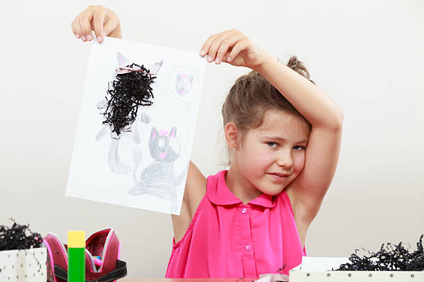 istock Little girl draw in the classroom 493943154