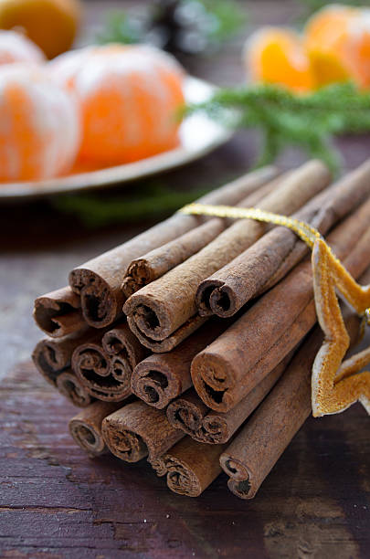 istock Winter Christmas decorations, tangerines and cinnamon 493943440
