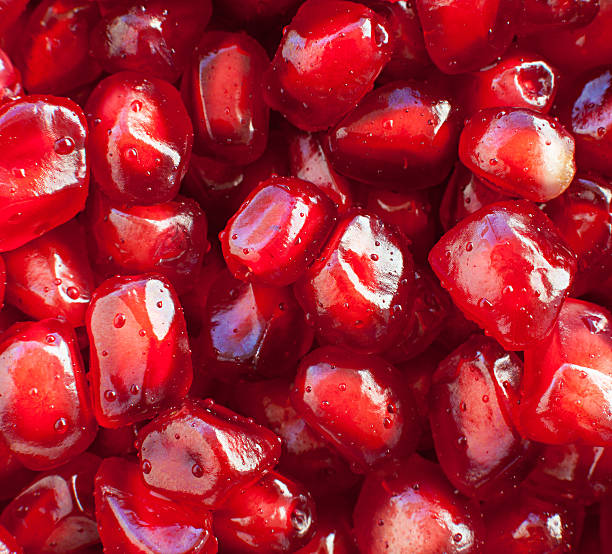 istock juicy pomegranate seeds close-up 493943940