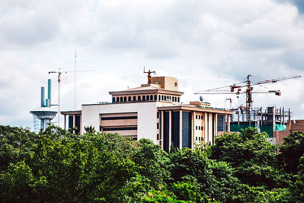 High Court government building in Abuja, Nigeria. Abuja, Nigeria - September 5, 2015: The Nigerian Federal High Court building seen from the park. abuja stock pictures, royalty-free photos & images