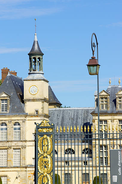 Chateau de Fontainebleau in France Fontainebleau, France - August 16, 2013: Chateau de Fontainebleau main entrance, (Palace of Fontainebleau), Ile de France, France. This palace has been used by french kings since 12th century as hunting lodge for its location in the Fontainebleau forest. In the 16th century, king Francis the 1st started the transformation from the medieval palace into a first variation of the present one. chateau de fontainbleau stock pictures, royalty-free photos & images