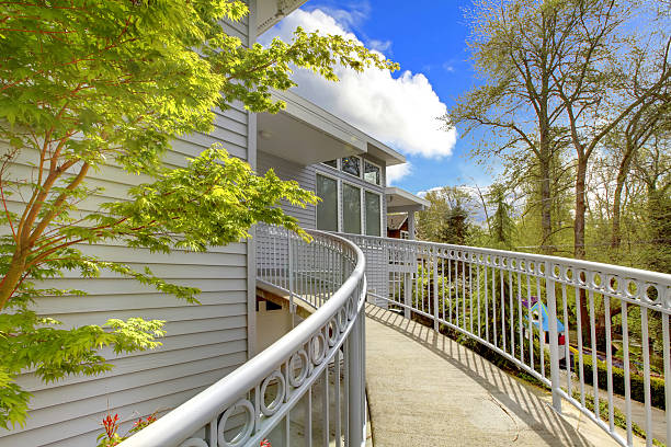istock Large grey house exterior of modern home with walkway. 493955795