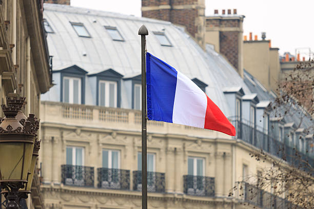 istock French flag front of building 493956953