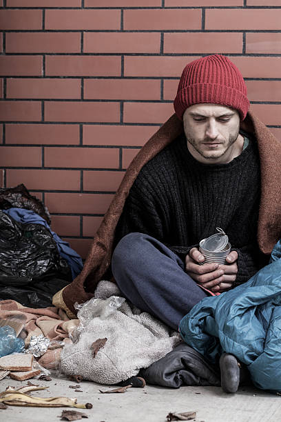 istock Poor, homeless man on the street 493959477