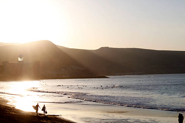 surfers walking on Las Palmas de Gran Canarias