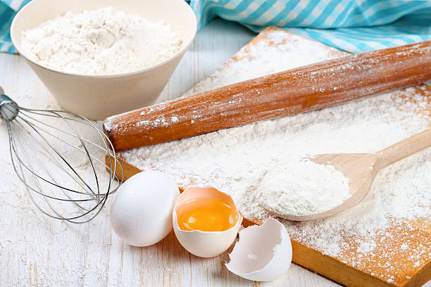 istock Baking ingredients on white wooden background 493968436