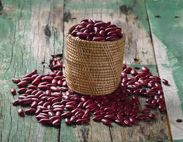 istock Red beans in the basket on old wooden 493968884