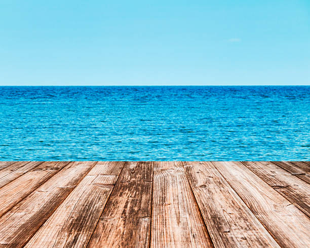 istock Coconut plank under image of peaceful sea 493969810