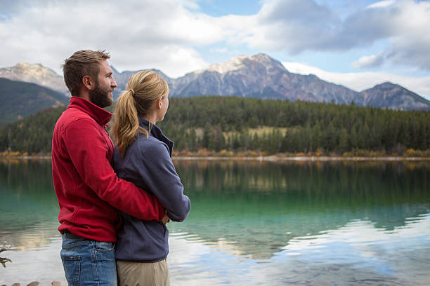 istock Young couple affectionate by the lake 493971032