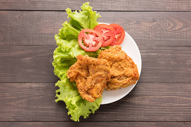 istock Fried chicken breast on a wooden background 493971580