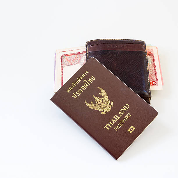 istock Thailand passport and Thai money 493971814