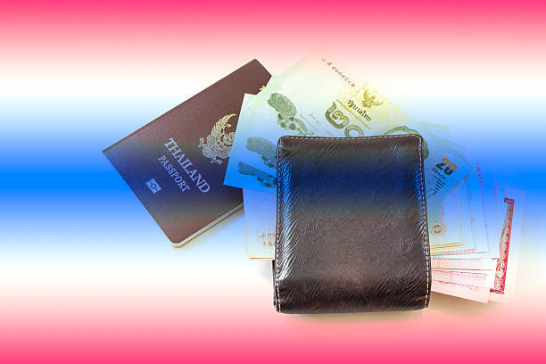 istock Thailand passport and Thai money 493971976