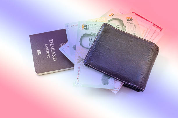 istock Thailand passport and Thai money 493972070