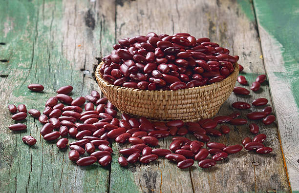 istock Red beans in the basket on old wooden 493973000