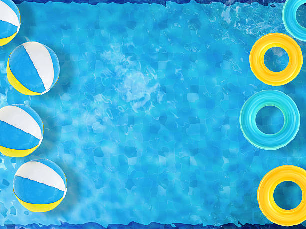 istock pool top view with swim rings and beach ball 493973314