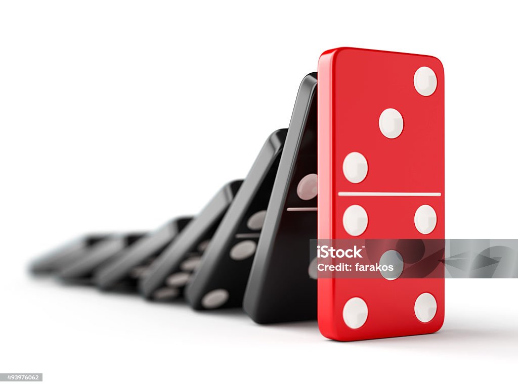 Domino effect Unique red domino tile stops falling black dominoes. Leadership, teamwork and business strategy concept. Domino Stock Photo