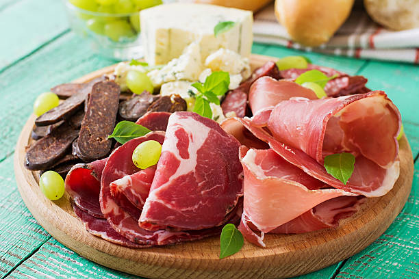istock Antipasto catering platter with bacon, jerky, sausage, blue cheese 493978330