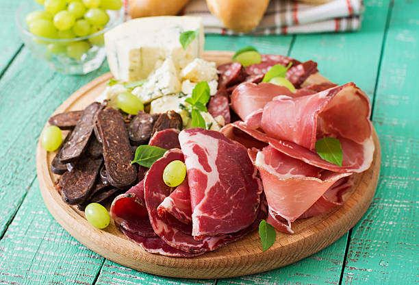 istock Antipasto catering platter with bacon, jerky, sausage, blue cheese 493978350