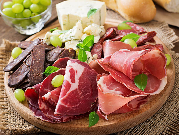 istock Antipasto catering platter with bacon, jerky, sausage, blue cheese 493978408