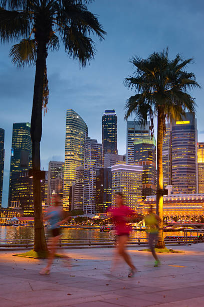 istock Young people jogging in night city 493978899