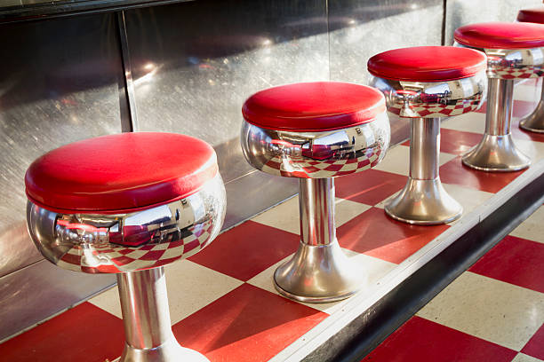istock Warm Morning Sunlight Highlights These Beautifully Classic Diner Seats 493979075