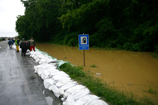 Serbia, Sremska Mitrovica - May 17 2014: The army, police and citizens together raise the walls banks with sandbags.The water level of Sava River remains high in worst flooding on record across the Balkans on may 17, 2014