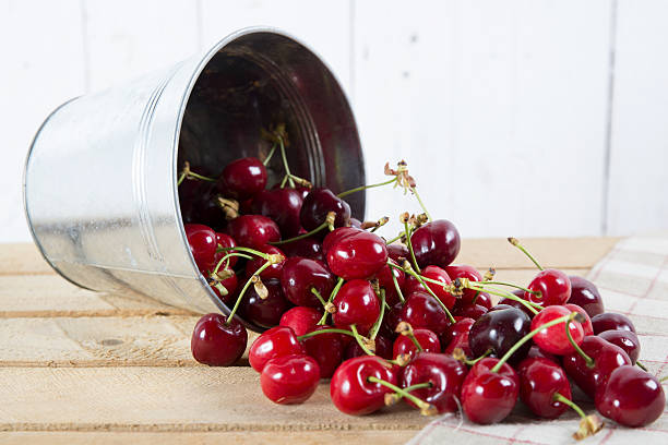 istock cherries in a small metal bucket overturned 493982465