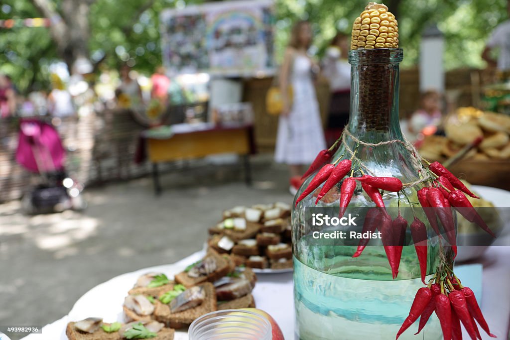 Bottle of moonshine Bottle of moonshine on a table at buffet 2015 Stock Photo