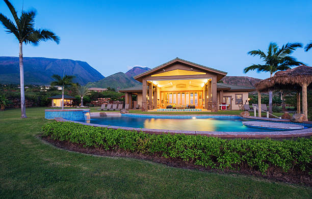 Luxury home with swimming pool Luxury home with swimming pool at sunset subdivision gate stock pictures, royalty-free photos & images