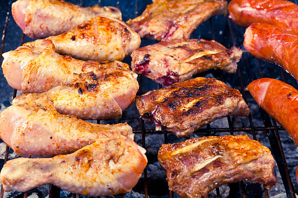istock sausage, raw ribs and chicken with barbecue 493985003