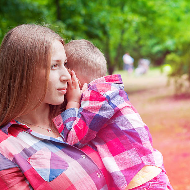 istock Young Mother and Her Son on Hands 493994200
