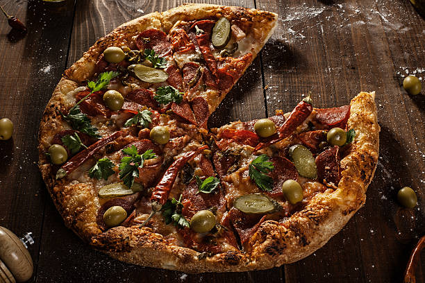 istock top view of fresh baked pizza without slice 493995012