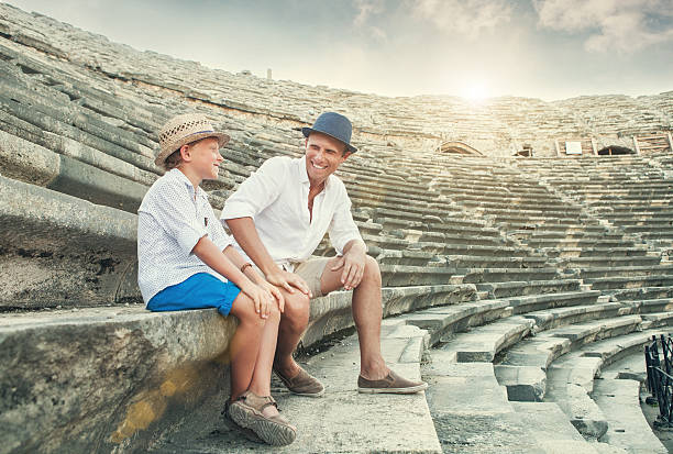 istock Father and son spent time together on antique ruins amphitheater 493996314