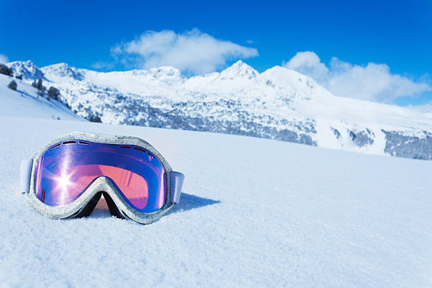 Ski mask Ski and snowboard mask in the snow with copy space and mountain on background face guard sport photos stock pictures, royalty-free photos & images