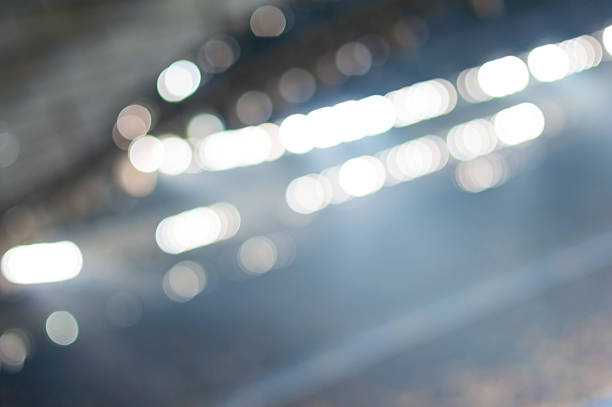 Blurred soccer stadium or ather sport arena at night with