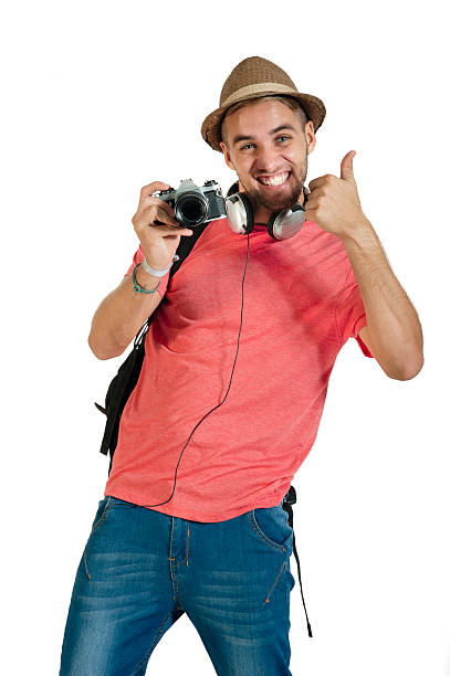 istock young handsome guy with film camera isolated on white 493997081