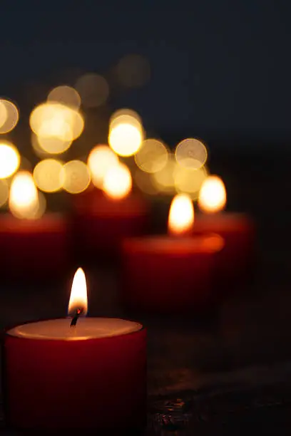 Lots of candles on dark background