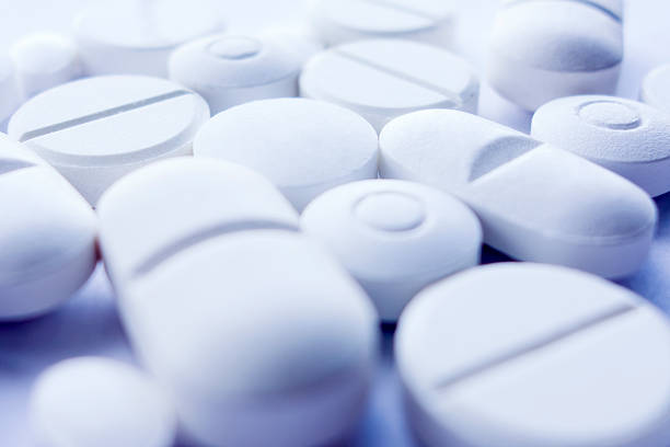 comprimido - painkiller vitamin pill full frame macro - fotografias e filmes do acervo