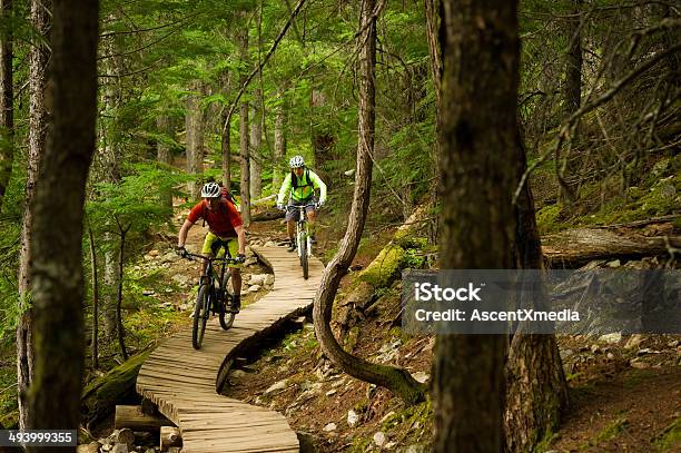 Mountain Biking Couple Stock Photo - Download Image Now - Mountain Biking, Mountain Bike, British Columbia