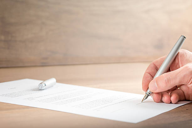 istock Close up Businessman Signing a Contract Document 494001710