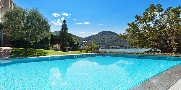 istock beautiful swimming pool overlooking the lake 494002156