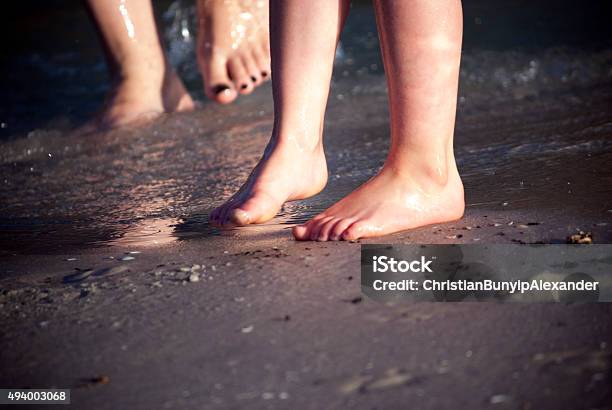 Mother And Child Feet In Sand Stock Photo - Download Image Now - 2015, 30-39 Years, Adult