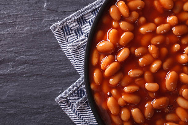 istock beans in tomato on a plate close-up. horizontal top view 494006232