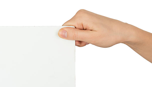 istock Womans hand holding angle of blank paper 494006418